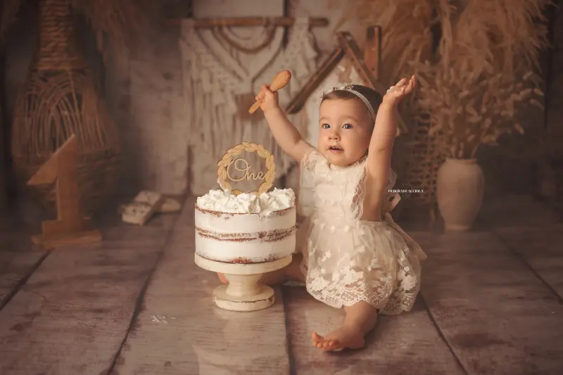 birthday portrait in studio in Orléans, France: celebration portrait, soft panoramic scene, light palette