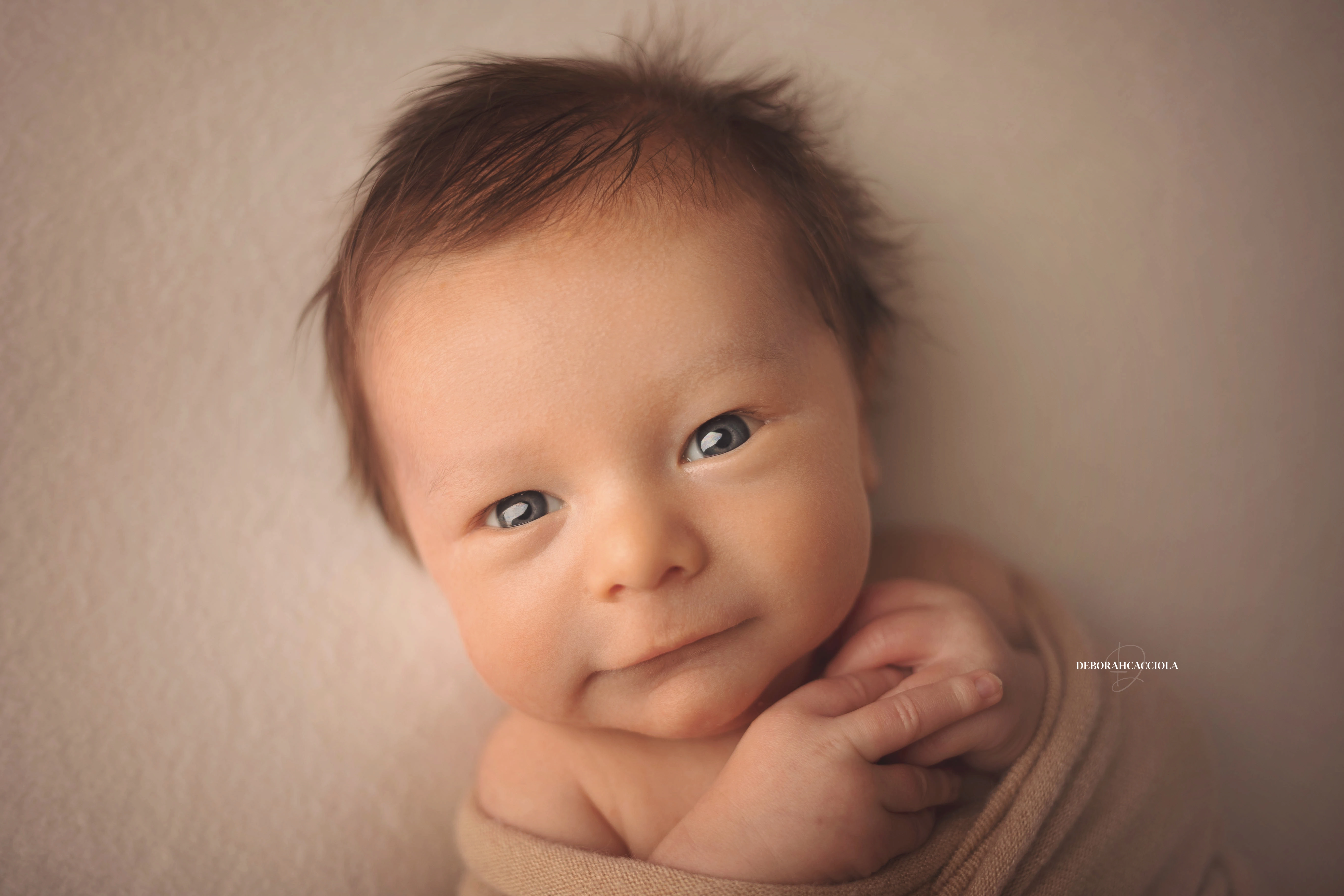 newborn portrait in Orléans, France: baby in the first days, wide natural composition, soft colors