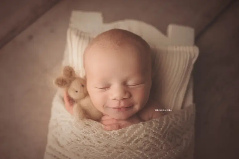baby session in Orléans, France - tender moment with baby, harmonious wide shot, natural tones