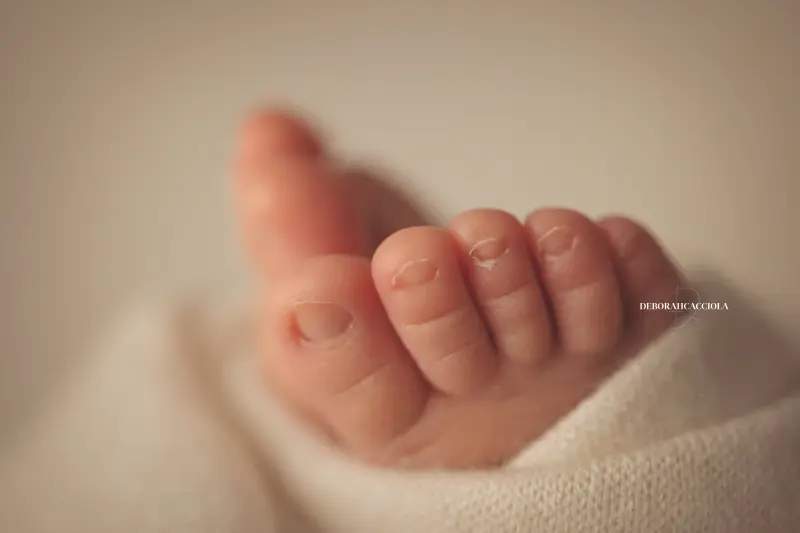 baby session in Orléans, France - tender moment with baby, harmonious wide shot, natural tones