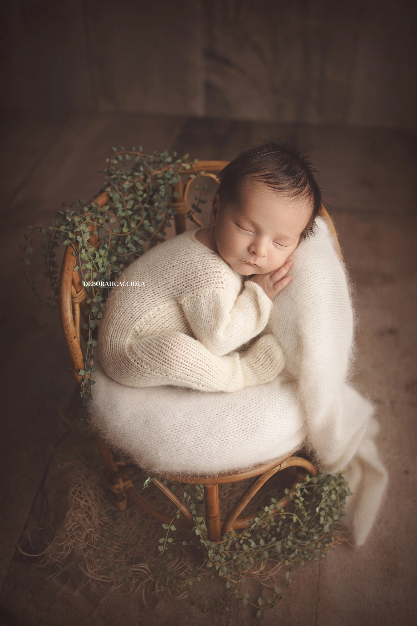 newborn portrait in Orléans, France: tender moment with baby, polished vertical portrait, natural tones