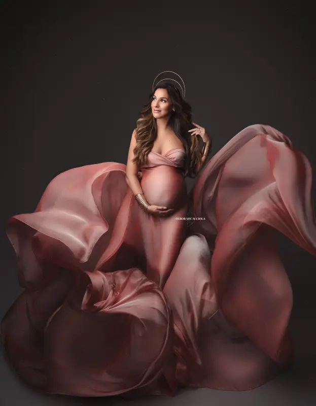 pregnancy portrait in Orléans, France: mother-to-be during a studio session, soft vertical framing, in color