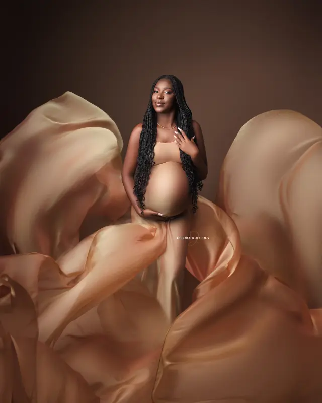 maternity portrait in Orléans, France: mother-to-be during a studio session, soft vertical framing, bright style