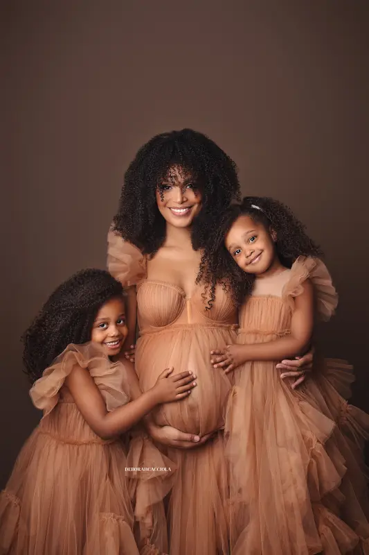maternity portrait in Orléans, France: pregnancy moment, elegant vertical shot, bright style