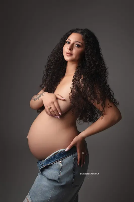 maternity portrait in Orléans, France, mother-to-be during a studio session, soft vertical framing, bright style