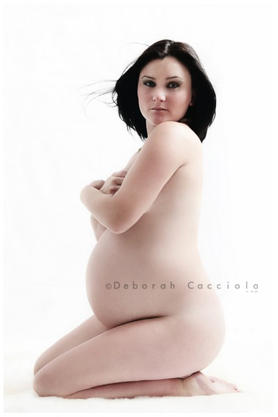 maternity portrait Orléans, France, mother-to-be during a studio session, soft vertical framing, bright style