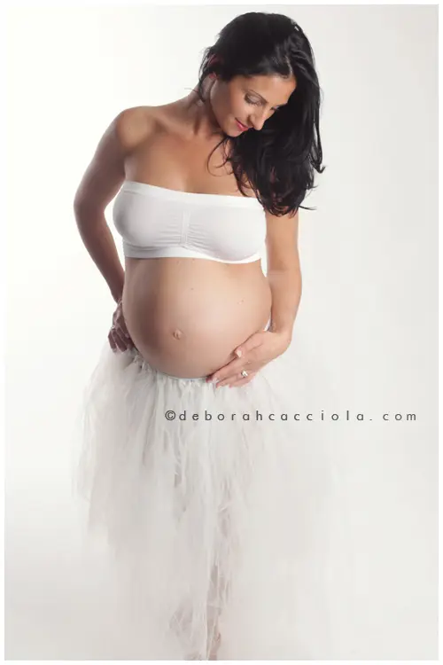 maternity portrait in Orléans, France, pregnancy moment, elegant vertical shot, bright style