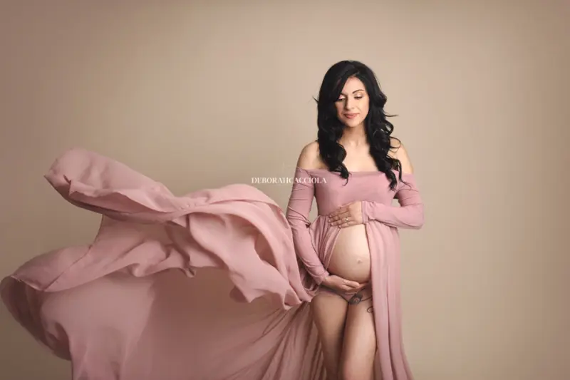 pregnancy scene in studio in Orléans, France: maternity silhouette, refined maternity styling, natural tones
