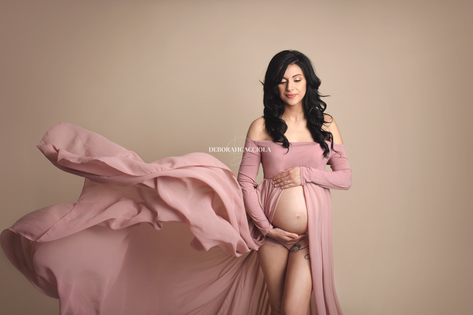 pregnancy scene in studio in Orléans, France: maternity silhouette, refined maternity styling, natural tones