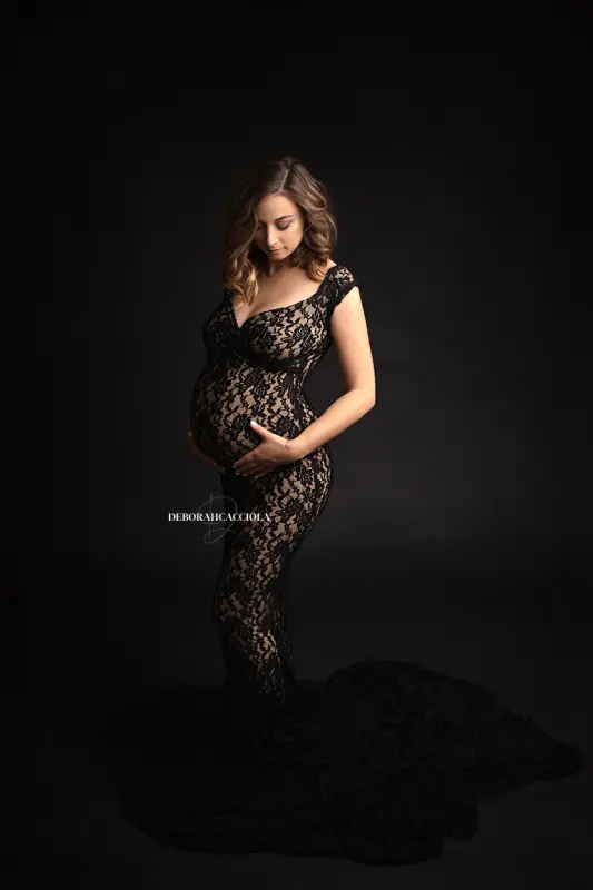 pregnancy photo in studio in Orléans, France: mother-to-be portrait, flowing dress, black-and-white style