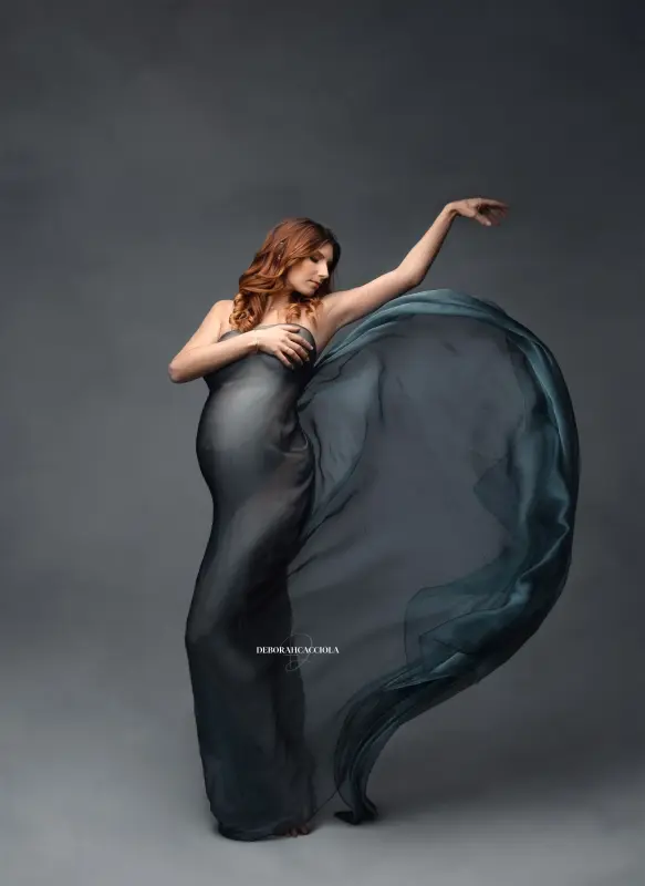 pregnancy portrait in Orléans, France, mother-to-be during a studio session, soft vertical framing, in color