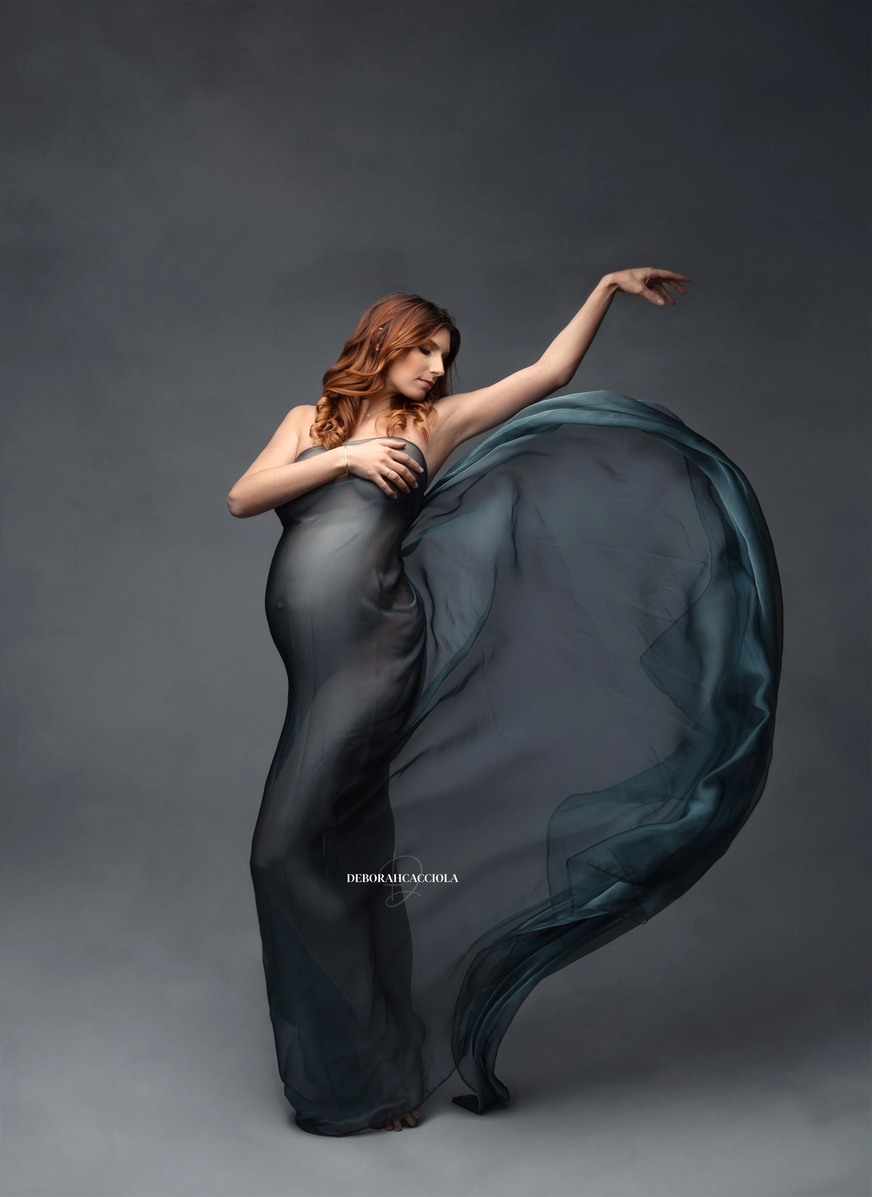 pregnancy portrait in Orléans, France, mother-to-be during a studio session, soft vertical framing, in color