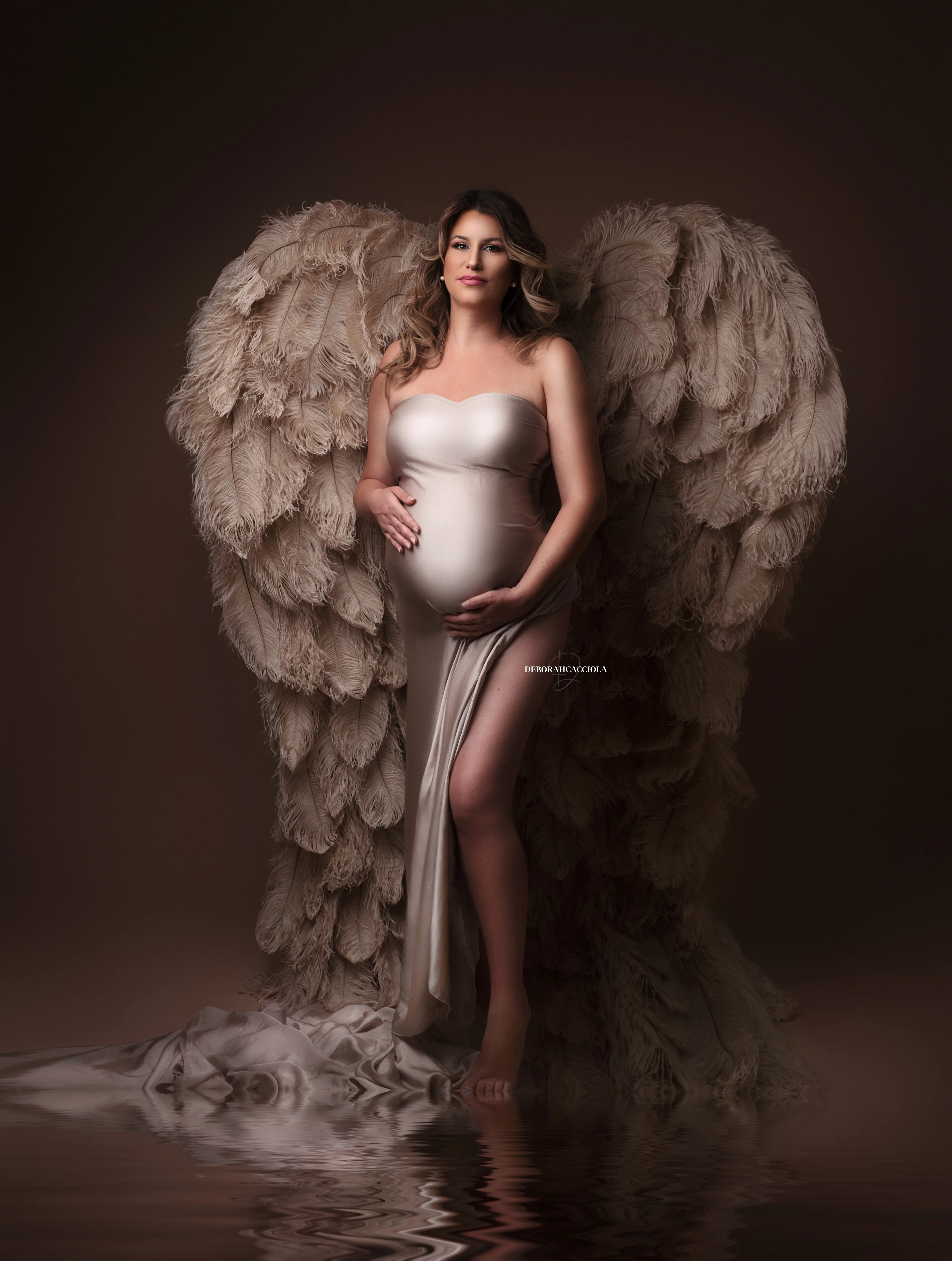 pregnancy portrait in studio in Orléans, France: mother-to-be during a studio session, soft vertical framing, in color